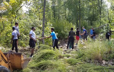 Members of the CCCB men's basketball team gathered stones from a stream bed in the Kiamichi Mountains last weekend as part of a mission trip.